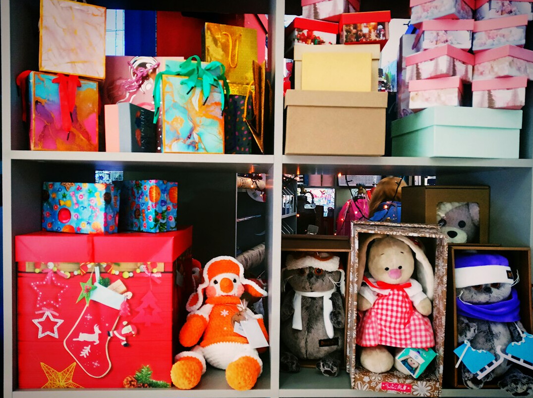 Storage boxes and baskets on shelves in a bright room